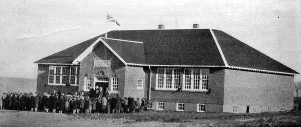 Students beside the newly-constructed “Brick School” of Birtle Consolidated School