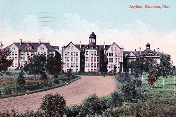 Postcard of the original Brandon Asylum for the Insane, showing the original structure at right, an addition constructed between 1892 and 1893 in the centre, and an addition constructed between 1903 and 1905 at left. The entire complex was destroyed by fire in November 1910