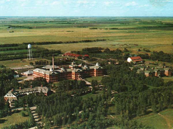 Aerial view of the Brandon Mental Hospital, with the Nurses’ Residence at left, Parkland Building in centre, and the Valleyview Building at right