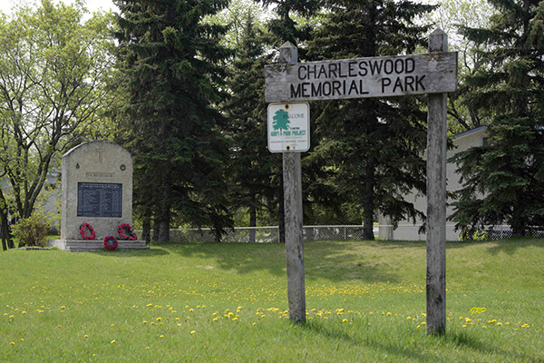 Charleswood Memorial Park Sign with War Veterans Monument in background