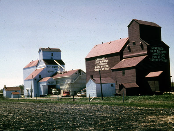 Manitoba Pool grain elevator at right and Paterson grain elevator at left