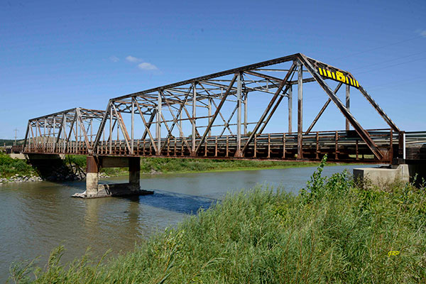 Steel through truss bridge over the Assinibone River