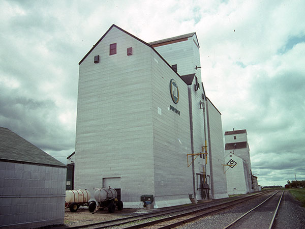 Manitoba Pool grain elevator, with a Paterson Grain elevator in the background, at Dufrost