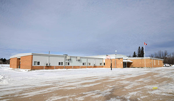 Eden Collegiate centennial monument in front of J. M. Young School