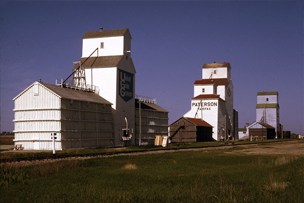 The grain elevators of Fairfax with United Grain Growers at left, Paterson in centre, and Manitoba Pool at right