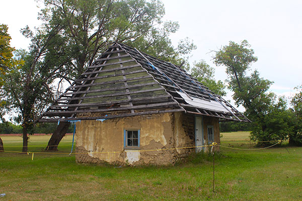 Thatched-roof clay house at the Gardenton Ukrainian Museum