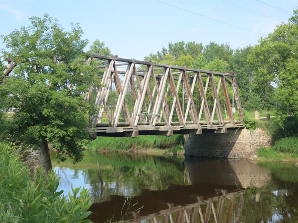 Wooden through truss bridge over the Roseau River