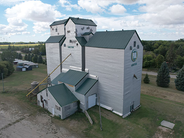 Aerial view of the Manitoba Pool Grain Elevator at Gretna with the former Federal Grain elevator at right