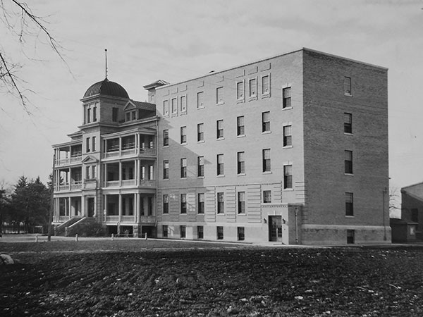 One of the original buildings at left and 1937-1938 addition, designed by architect Gilbert C. Parfitt, at right at Manitoba School for Mental Defectives