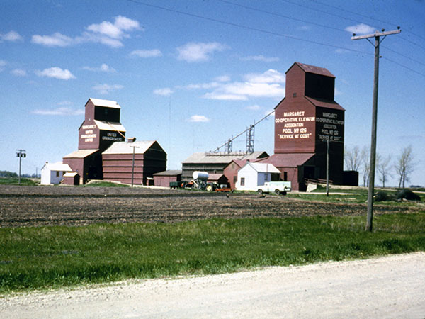 Manitoba Pool grain elevator (right) and United Grain Gowers grain elevator (left) at Margaret