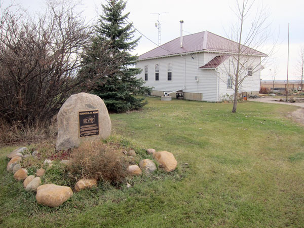 Mason School commemorative monument and the former school building