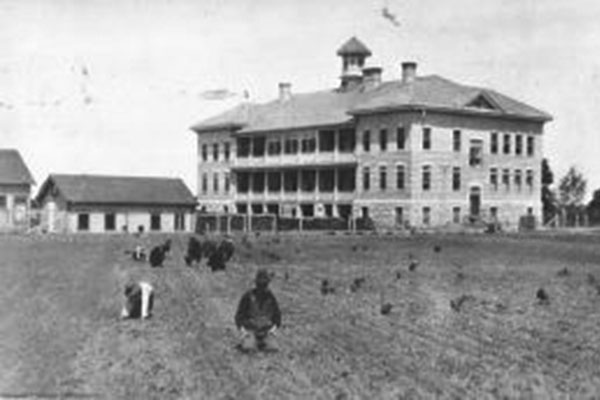 Children in the planting fields at Portage Indian Residental School