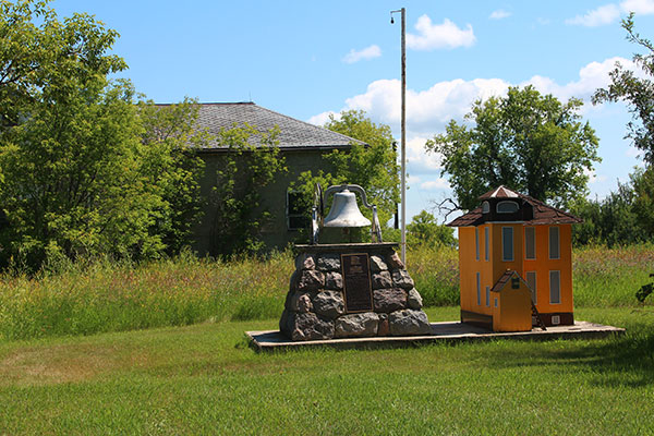 Tilston School monument, replica and building