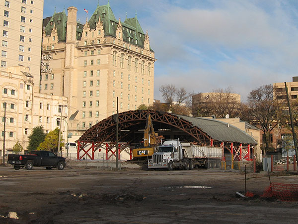 Demolition of the Grain Exchange Curling Club rink in preparation for development of the Upper Fort Garry Provincial Park