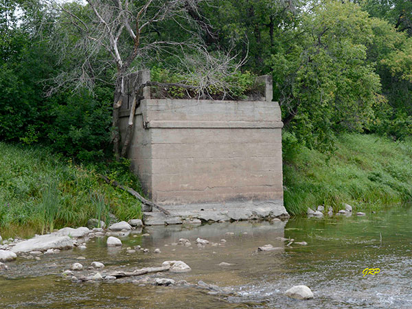 Concrete abutment for the original bridge to which the suspension bridge connected